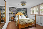 The Somerville garden suite with a luxury antique bed